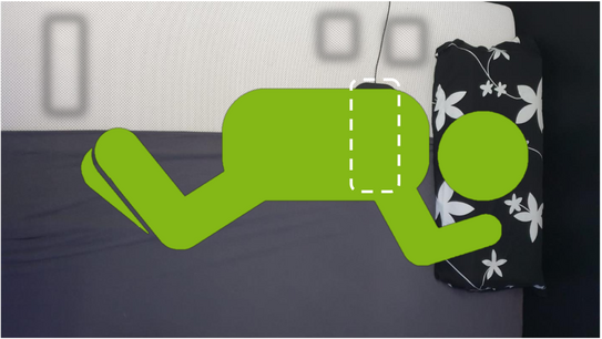 Schematische Positionierung des Minimalkontaktsensors unter einer Person. Der Sensor liegt auf Höhe des Brustkorbs.